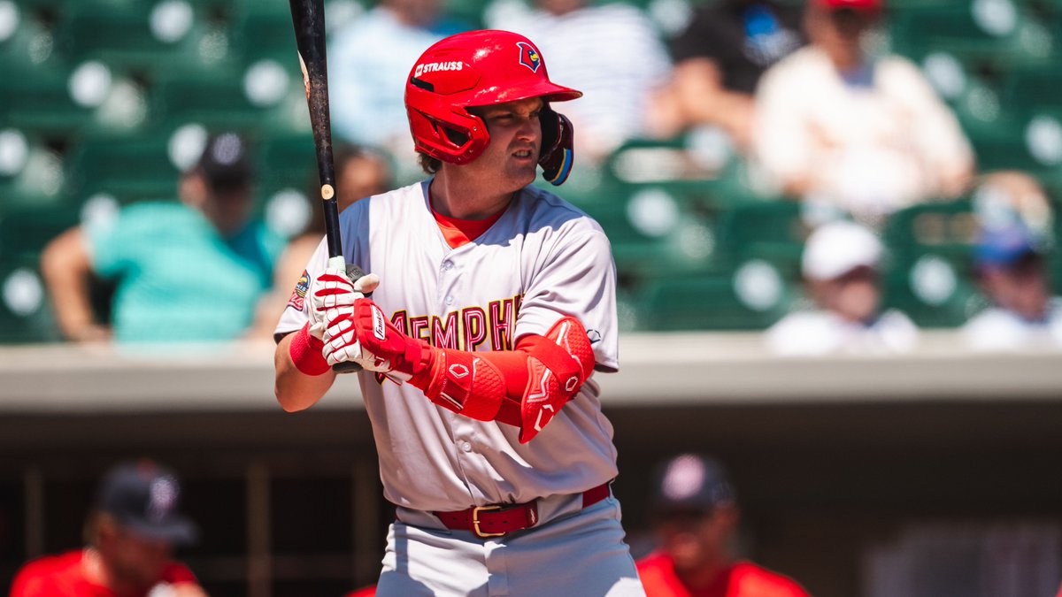 An image of Blaze Jordan batting from the right side. He is wearing a gray Memphis Red Birds jersey and red helmet