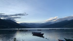 Boat In Lake Against Sky During Sunset