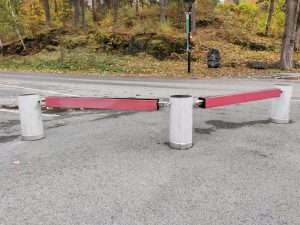 Stone and metal barrier. Nature in the background.