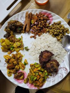Home made Nepali khaja set with flattened rice, beans, chichken roast, sussage, potato sadheko, etc