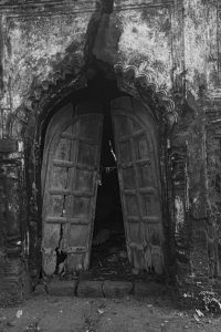 The broken wooden door of the 500-year-old abandoned Kanakdurga temple at Jhargram.