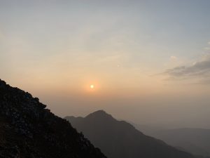 Orange sunrise over hazy mountains in Devchuli, Nawalparasi.