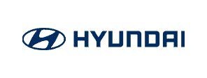 Logo Hyundai ditampilkan dengan jelas, menunjukkan identitas merek otomotif terkenal. Latar belakangnya berwarna biru, menambahkan kesan modern dan profesional.