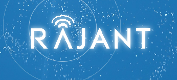 The word "RAJANT" in white, futuristic font on a blue background with circular digital signal and particle effects. The letter "A" includes a wireless signal icon above it.