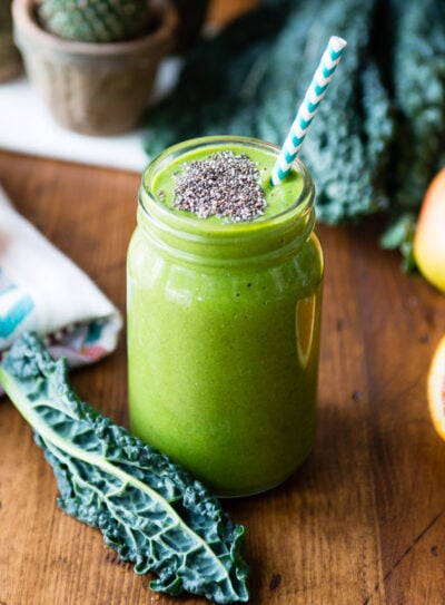 A fresh glass of kale smoothie with chia seeds on top