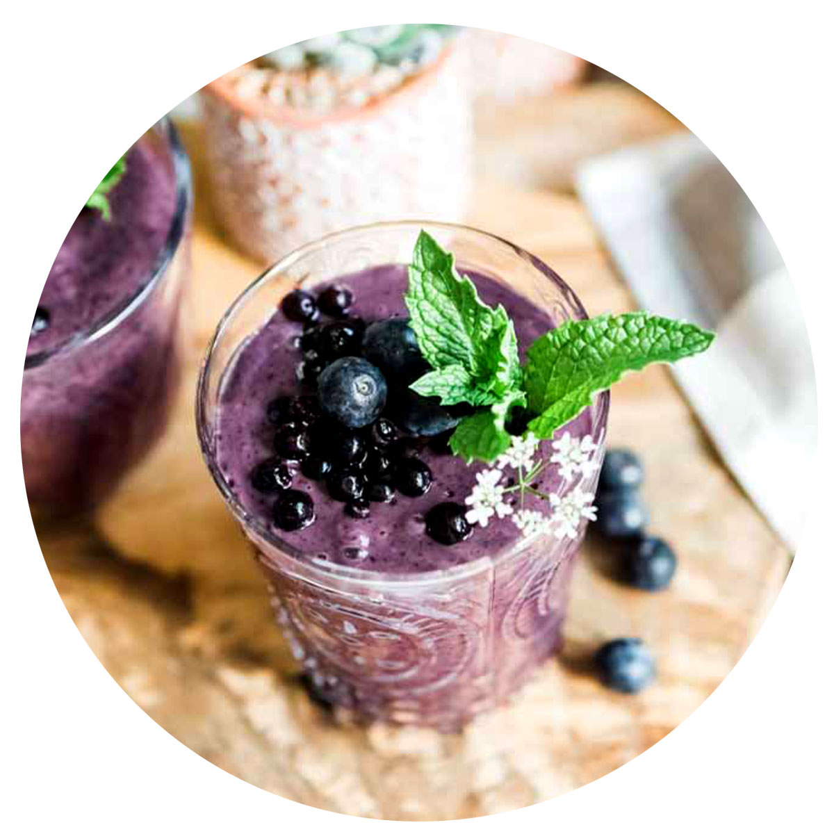Purple smoothie topped with blueberries.