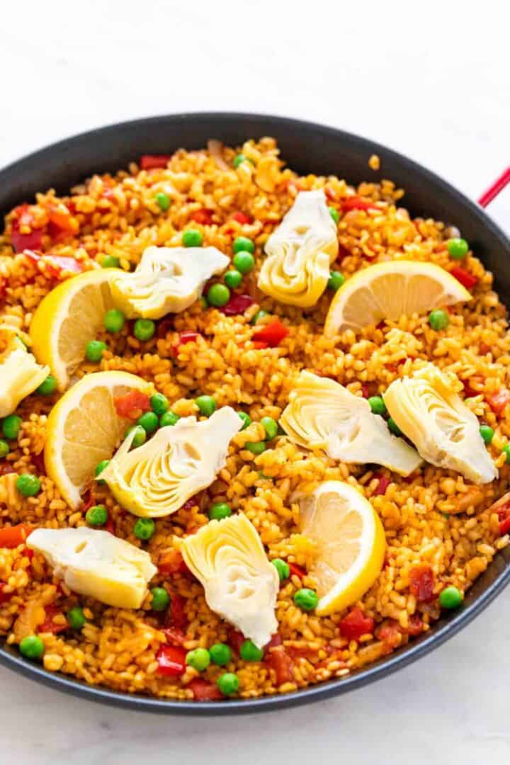 Vegan paella in a paella pan.
