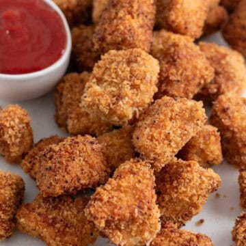 Tofu chicken nuggets with ketchup for dipping.