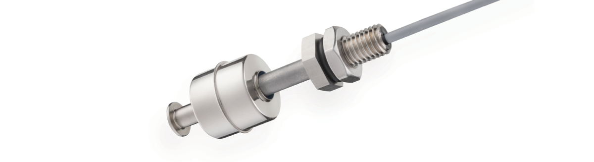 A close-up of a Standex Detect metallic electronic sensor with a cylindrical float, mounted on a threaded fitting, and attached to a cable against a white background. by Standex Detect