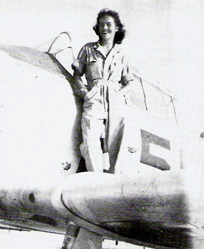 Baumgartner, Ann Gilpin, Women Airforce Service Pilots, stands on the wing of a North American Aviation T-6 Texan trainer, circa 1943. (United States Air Force)