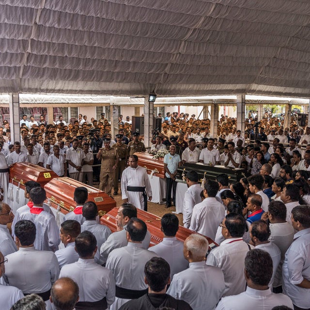 A mass funeral on Tuesday at St. Sebastian’s Church in Negombo, Sri Lanka. As many as 100 people were killed in a suicide bombing at the church on Easter Sunday.