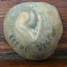 Tom Betts handed beach pebbles to illustrate his talk. This one looked like it had a badger's head on it, very appropriate for Feral Vector.