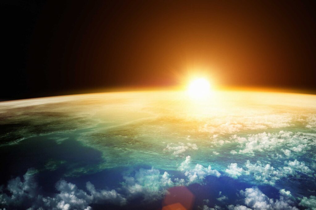 View from space of the sun rising from behind the Earth