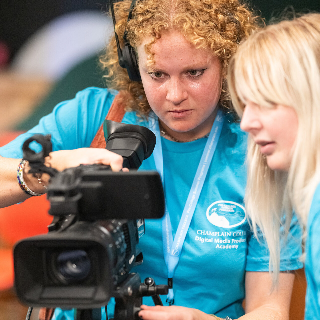 pre-college students work with a video camera in the studio