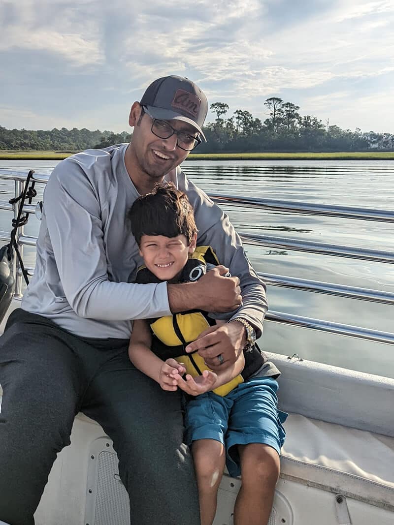 Solomon and I on the boat after seeing Dolphins - Syed Balkhi Solomon and I on the boat after seeing Dolphins