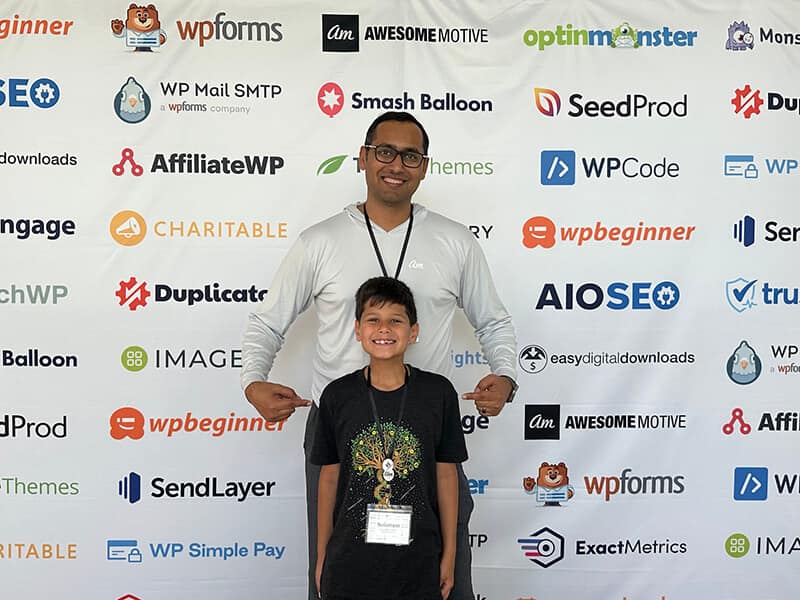 Syed and Solomon at Awesome Motive retreat banner - Syed Balkhi Syed and Solomon at Awesome Motive retreat banner