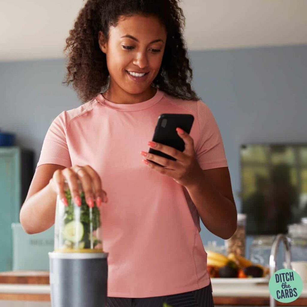 woman looking confused on her phone while carb counting