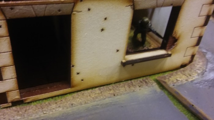 Peek-a-boo! Germans decamp from the house.