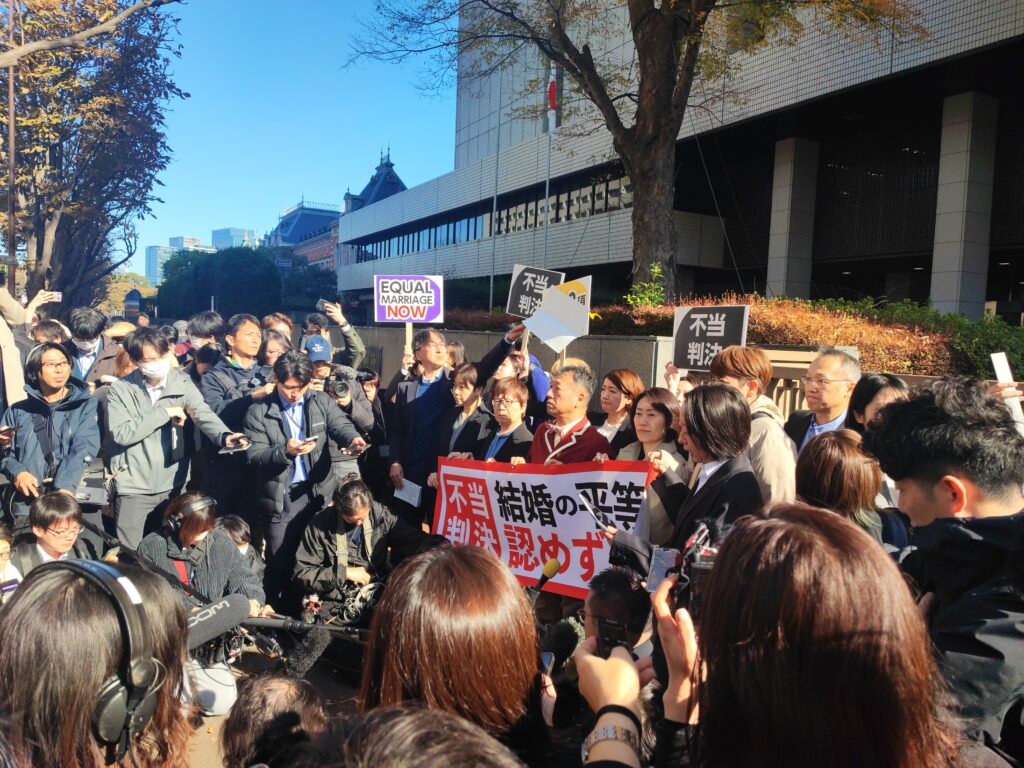 Picture outside of court after marriage equality decision handed down