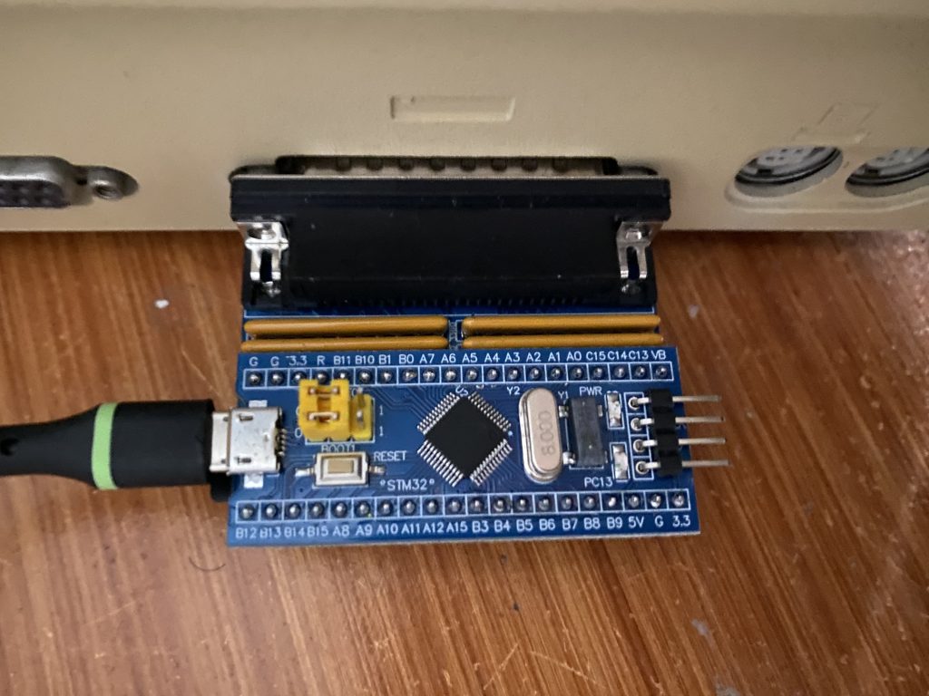 bluescsi on the back of the Macintosh Plus