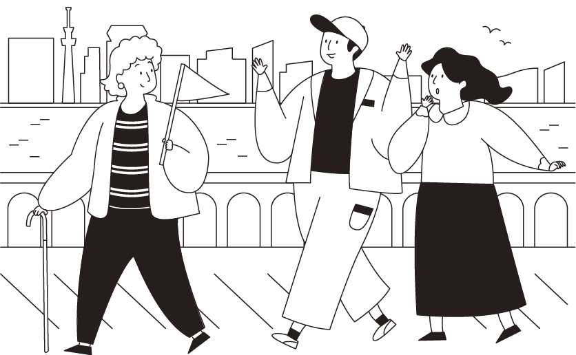 杖をついて街歩きガイドをする文子さん。川辺で男女を案内しています。