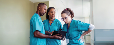 3 healthcare professionals in scrubs