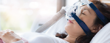 Patient in hospital bed.