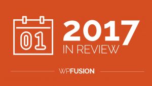 The image showcases a stylized white calendar icon with 01 on it against a vibrant orange background. To the right, large white text reads 2017 in Review, highlighting the year. Below, it says WPFusion in crisp white letters.