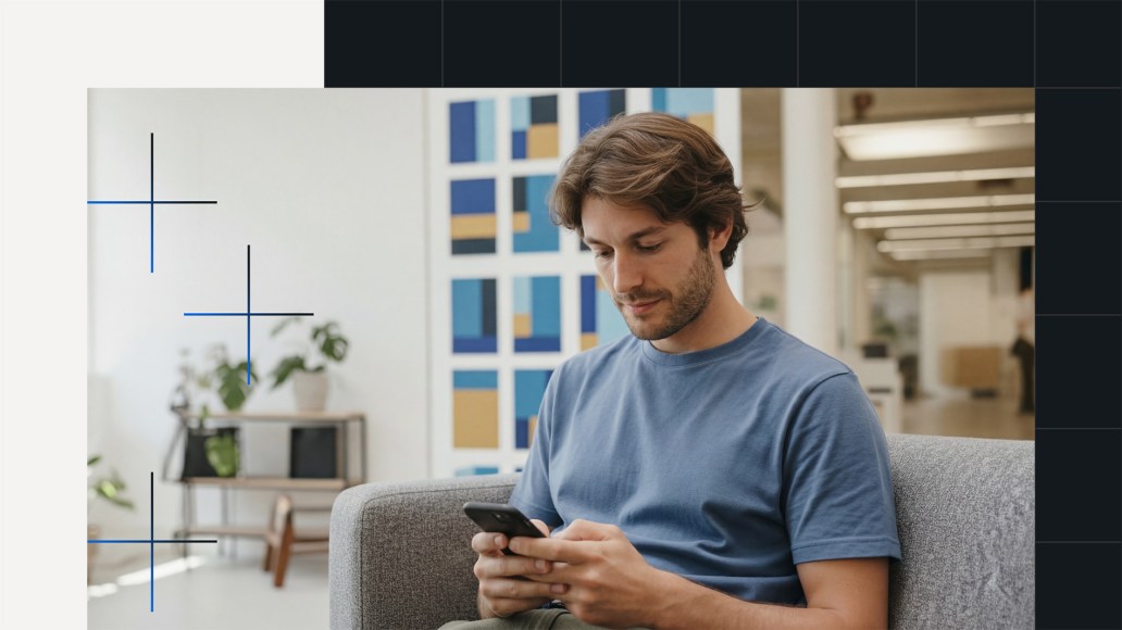 Person working on a smart phone at an office, symbolizing how a CMS enables teams to build amazing, flexible digital experiences.