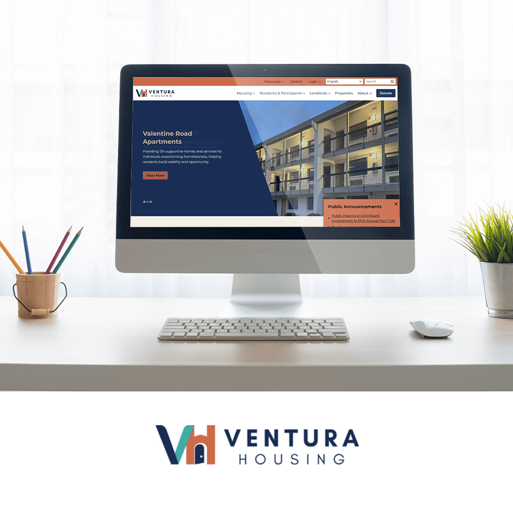 Ventura Housing redesigned website on monitor screen with Ventura Housing logo underneath.