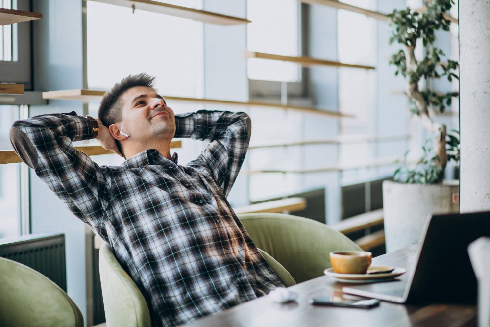 Young business owner looking relaxed and happy