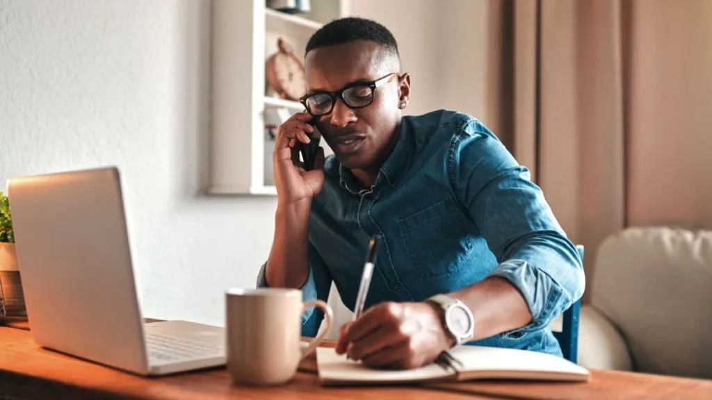 Man calling GreenPath to talk about a debt management plan.