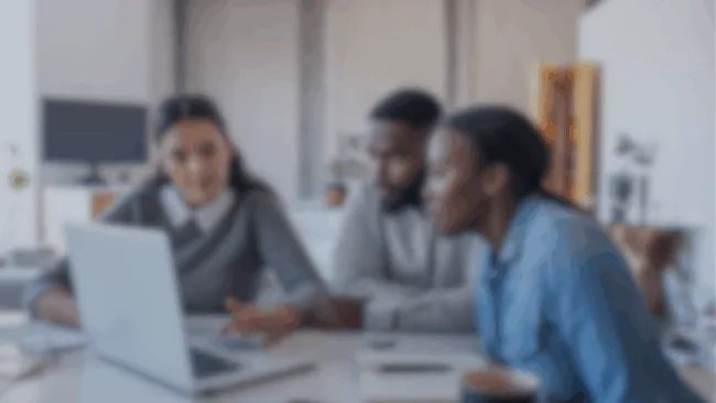 a young couple speaking with a GreenPath financial expert.