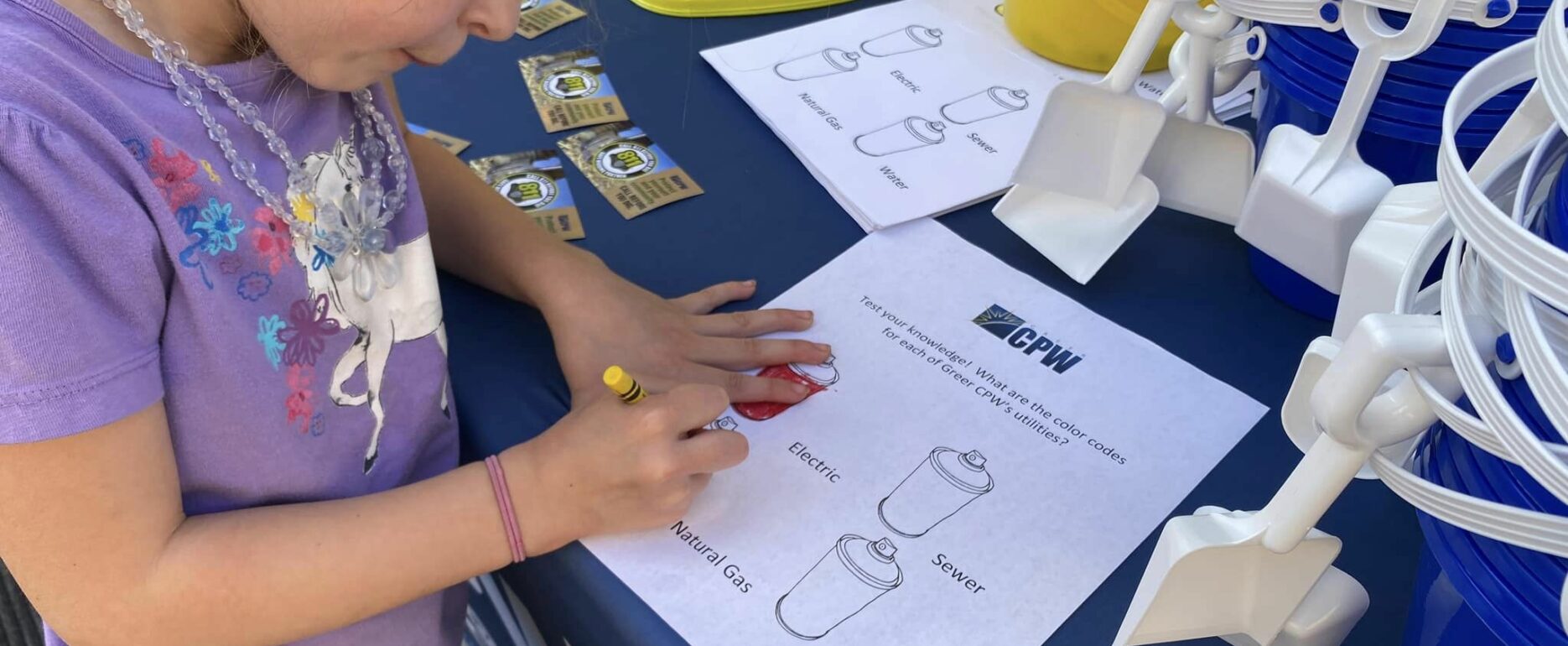 child coloring at the "Get the Scoop on 811" event