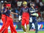 Krunal Pandya and his RCB teammates celebrate Jos Buttler's dismissal. Krunal Pandya and his RCB teammates celebrate Jos Buttler's dismissal.
