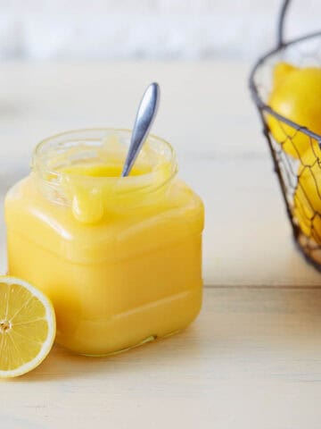 Lemon Curd in a glass jar made in the Thermomix in a jar on the bench