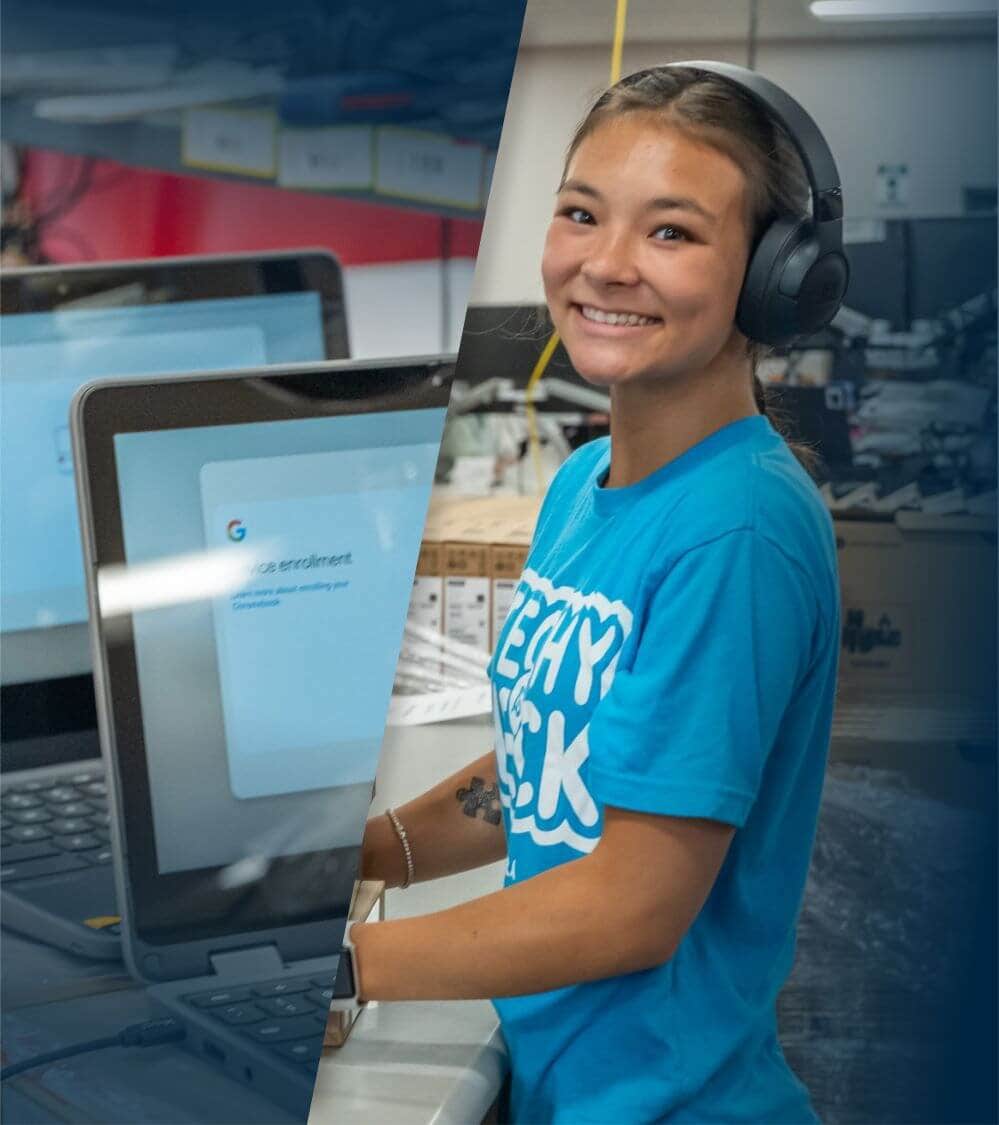 young IT technician in a computer workshop smiling