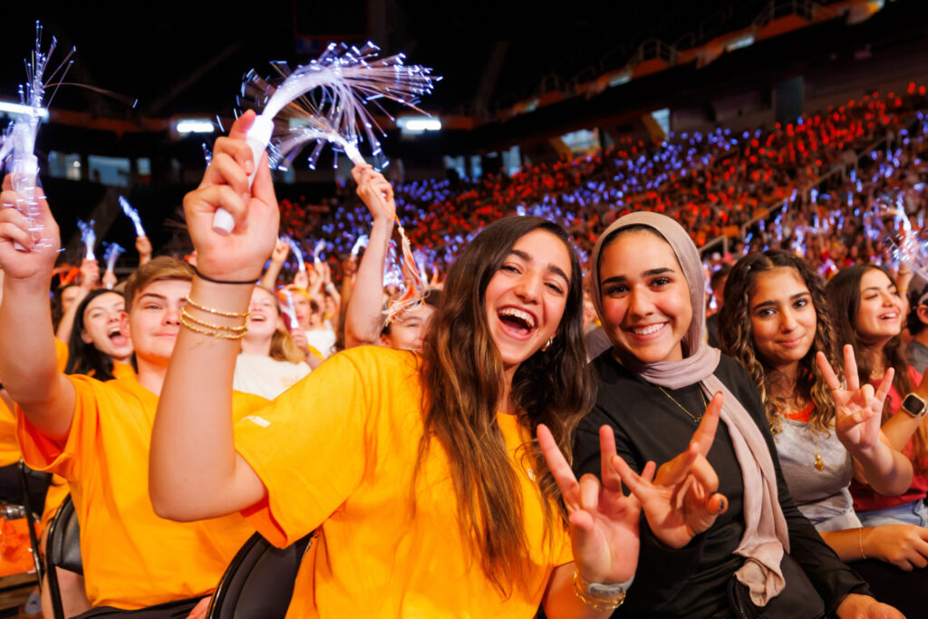 Students pose for a group photo during Rocky Top Rally inside Thompson-Boling Arena at Food City Center on August 18, 2024. Photo by Steven Bridges/University of Tennessee.