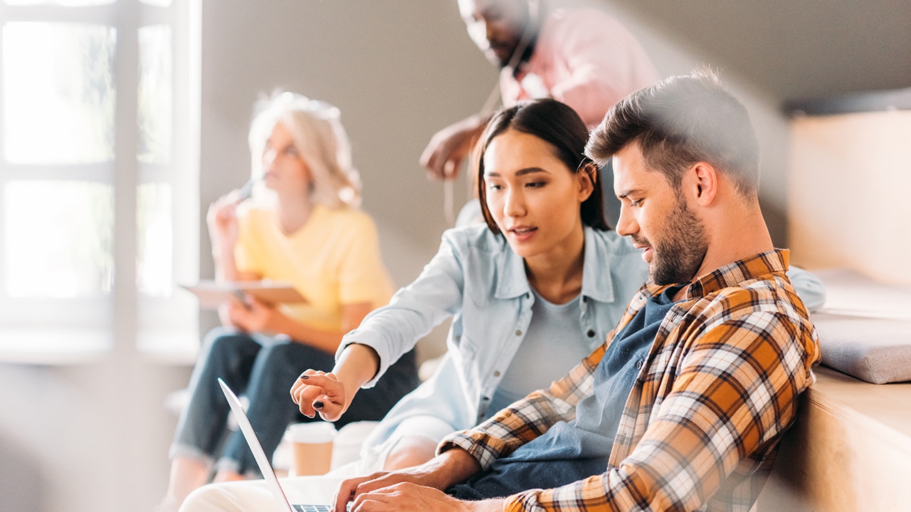 students working on computer in classroom