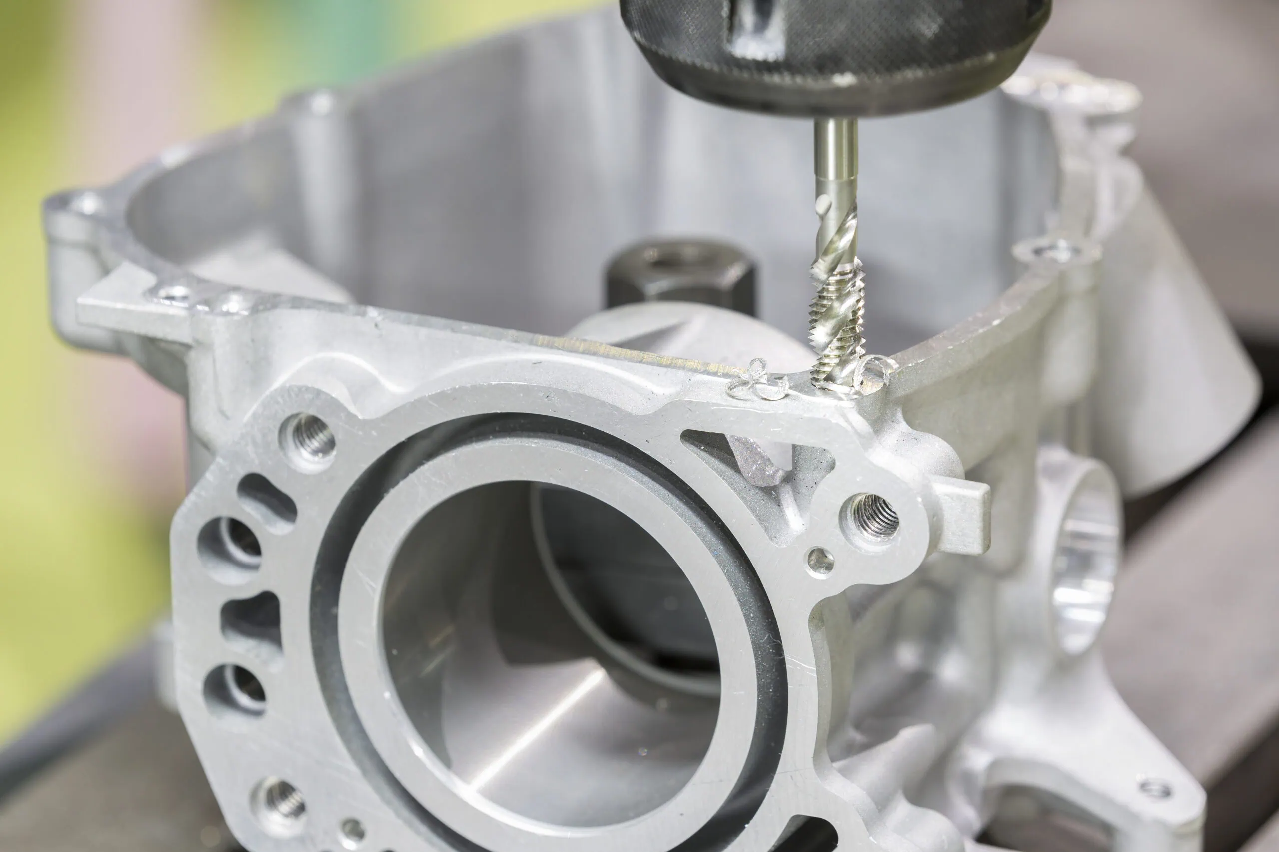 Tapping aluminum automotive part by cnc machining center